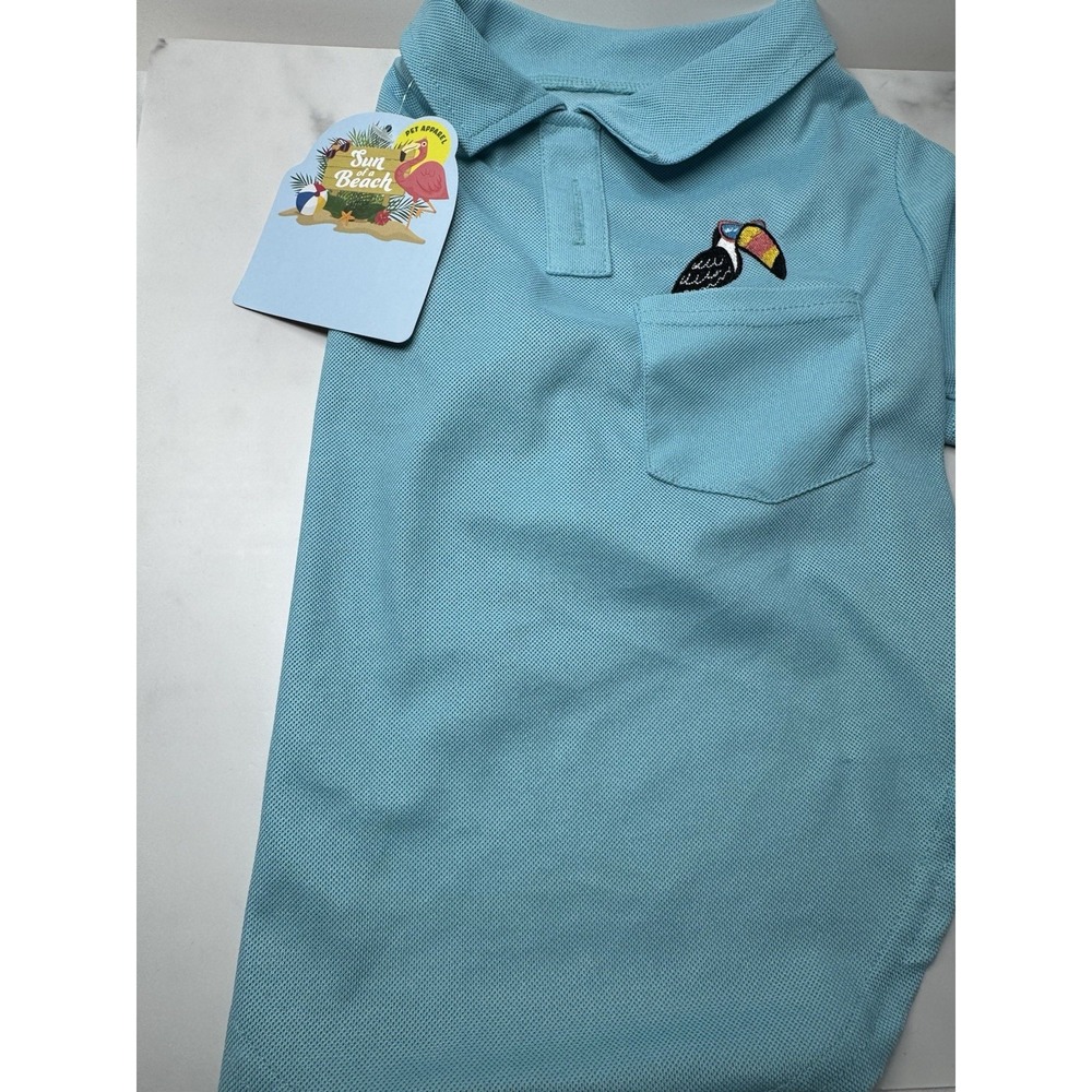 a turquoise pet apparel polo shirt with a "Sun Beach" tag Medium
